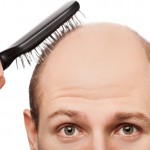 bald man with a brush