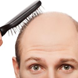 bald man with a brush